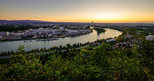 High angle view of city at riverbank