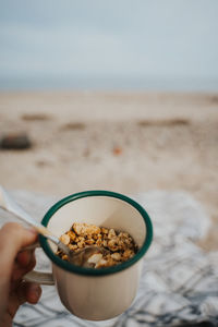 Midsection of person having breakfast