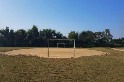 View of soccer field against clear sky