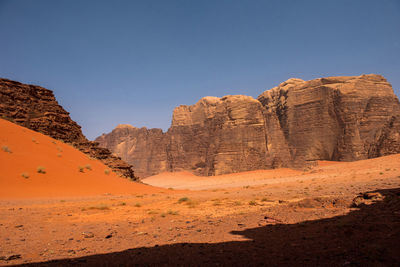 Rock formations in desert against sky