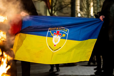 Flag of ukraine, luhansk or lugansk and battle flag upa near the border with russia, donbas region
