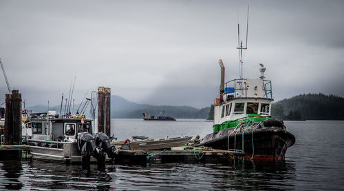 Boats in sea against sky