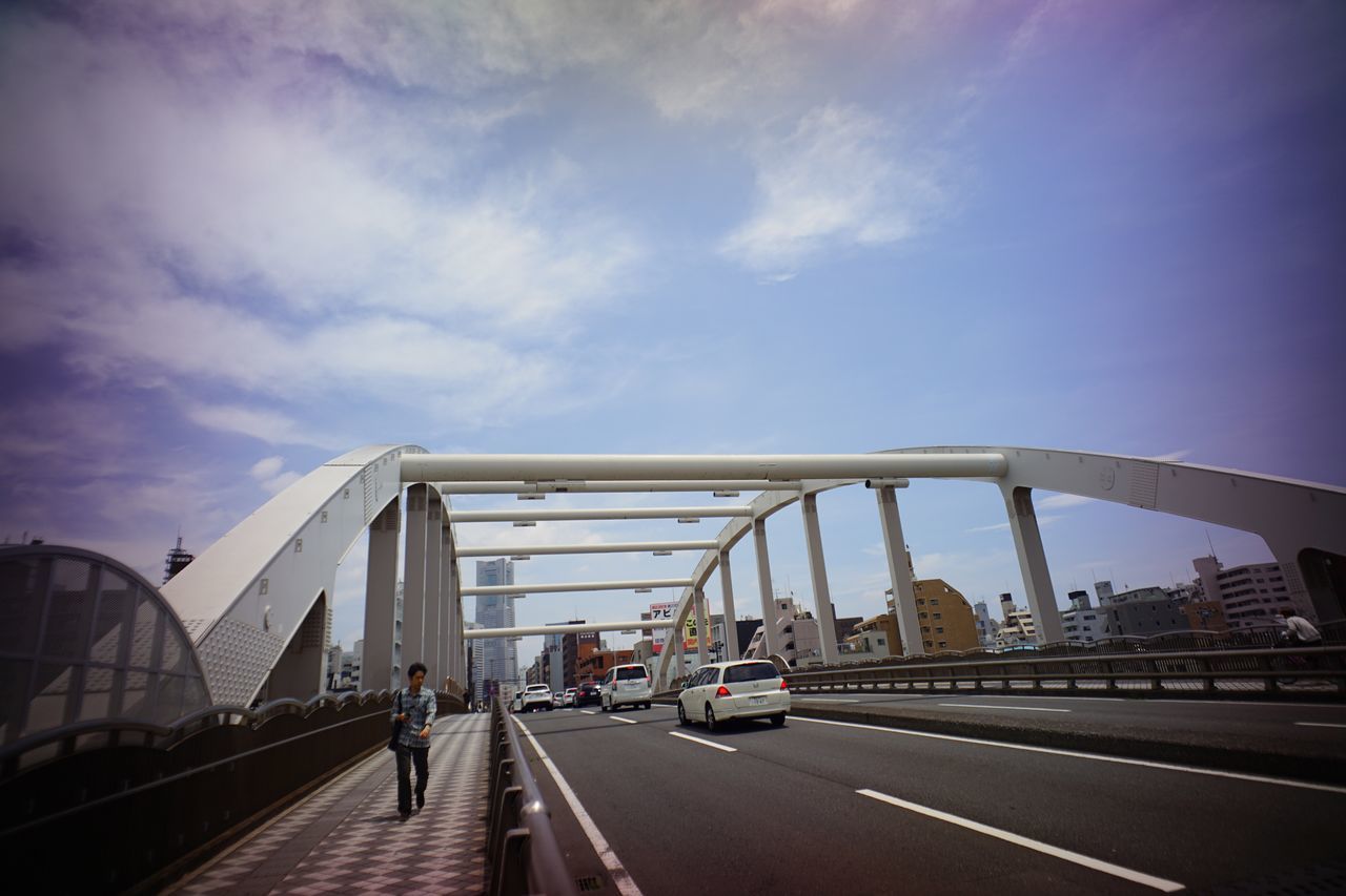 architecture, built structure, transportation, bridge - man made structure, city, building exterior, connection, sky, car, road, engineering, land vehicle, city life, bridge, the way forward, mode of transport, travel, street, travel destinations