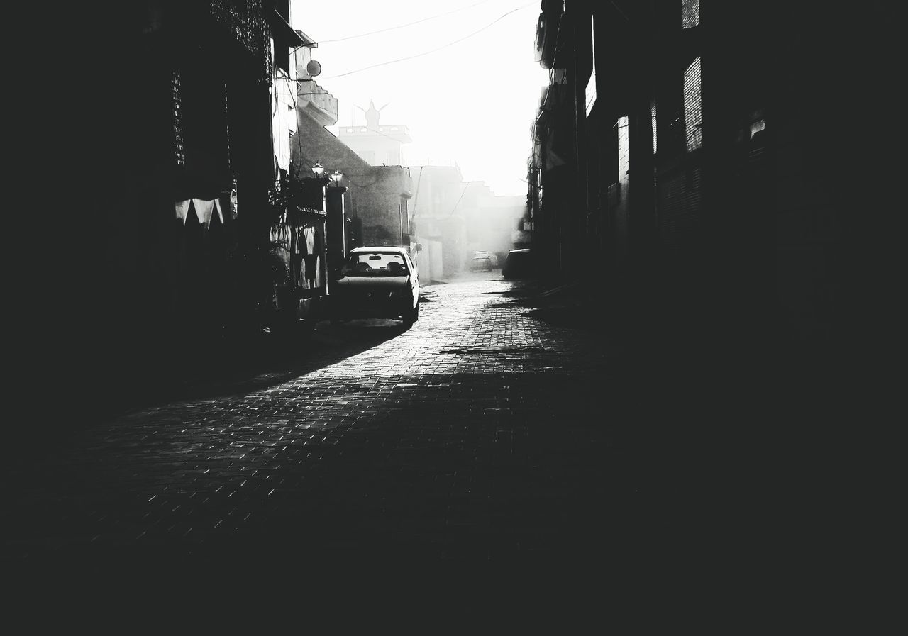 CAR ON STREET IN CITY