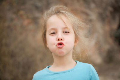 Portrait of cute girl puckering lips