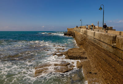 Scenic view of sea against blue sky