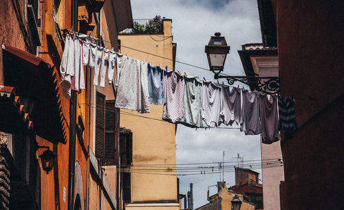 Low angle view of clothesline against clear sky