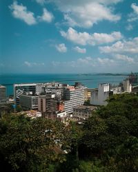 Scenic view of beach and buildings against sky