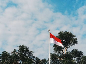 Low angle view of flag against sky