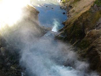Close-up of waves splashing on sea against sky