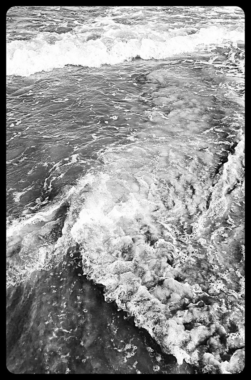 WAVES SPLASHING ON ROCKS