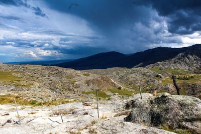 Scenic view of landscape and mountains against sky