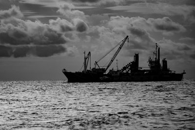 Silhouette of sailboat in sea