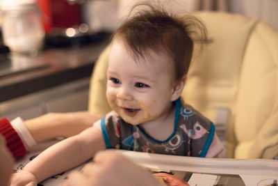 Portrait of cute baby boy at home