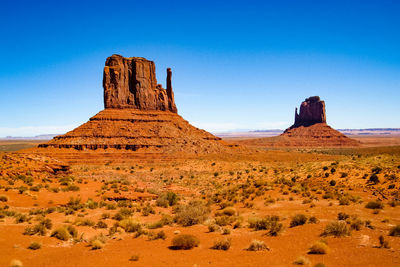 View of rock formations against blue sky