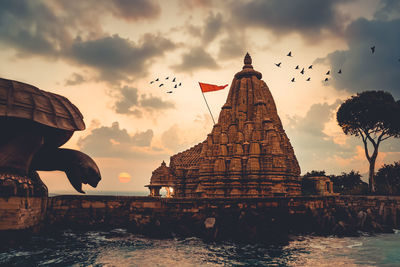 Low angle view of temple against sky during sunset