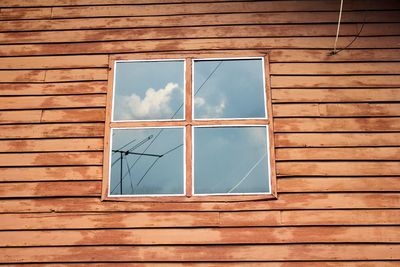 Low angle view of window on house wall