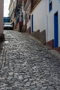 Surface level of footpath amidst buildings in city