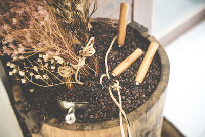 High angle view of roasted coffee beans in wooden container