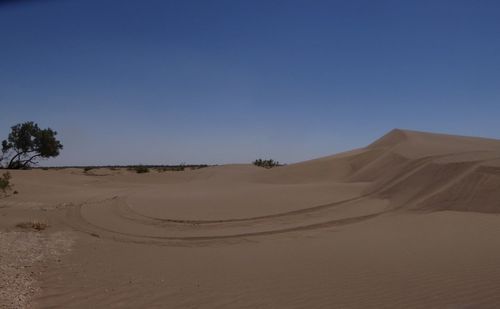 Scenic view of desert against clear sky