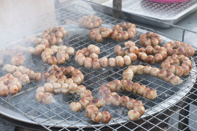 High angle view of meat on barbecue grill