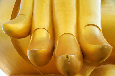 Close-up of gold colored statue