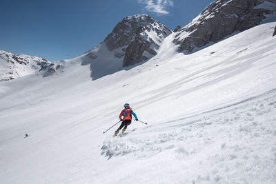 High angle view of man skiing on snow covered mountain