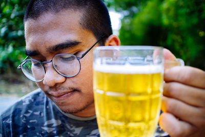 Close-up of man drinking glass