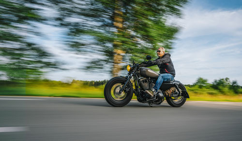 Man riding bicycle on road