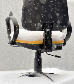 Side view of a snow covered car