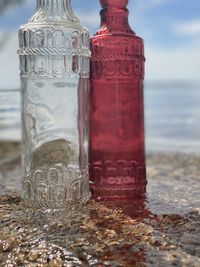 Close-up of water bottle on table at beach