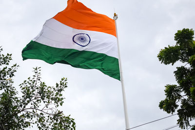 India flag flying high at connaught place with pride in blue sky, india flag fluttering, indian flag