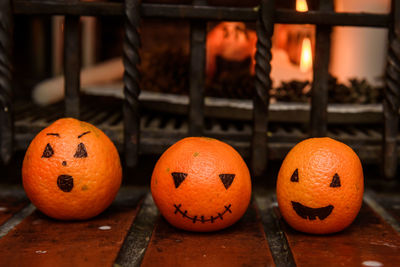 Close-up of jack o lantern on fence