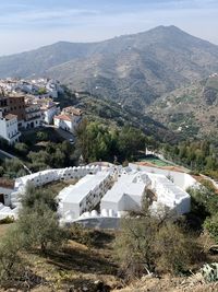 High angle view of townscape and mountains