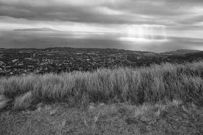 Scenic view of landscape against cloudy sky