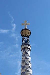 Low angle view of tower at park guell against sky