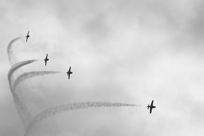 Low angle view of airplane flying in sky