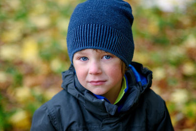 Portrait of boy in park during winter