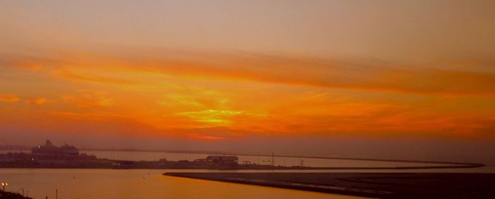 Scenic view of sea against romantic sky at sunset