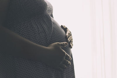 Low section of man wearing shoes