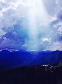 Scenic shot of clouds over mountain range