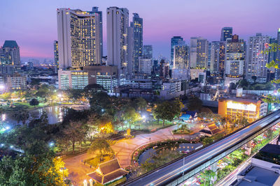 High angle view of illuminated buildings in city at night