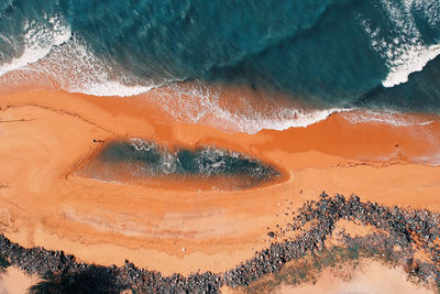 High angle view of sea shore during sunset