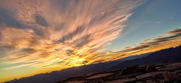 Low angle view of silhouette mountains against sky during sunset