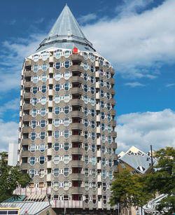 Low angle view of modern buildings against sky