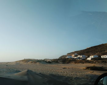 Scenic view of desert against clear sky