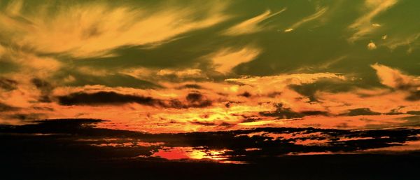 Low angle view of dramatic sky during sunset