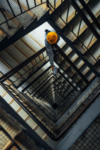 High angle view of people walking on staircase