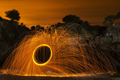 Light trails against sky at night