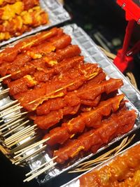 High angle view of meat on barbecue grill